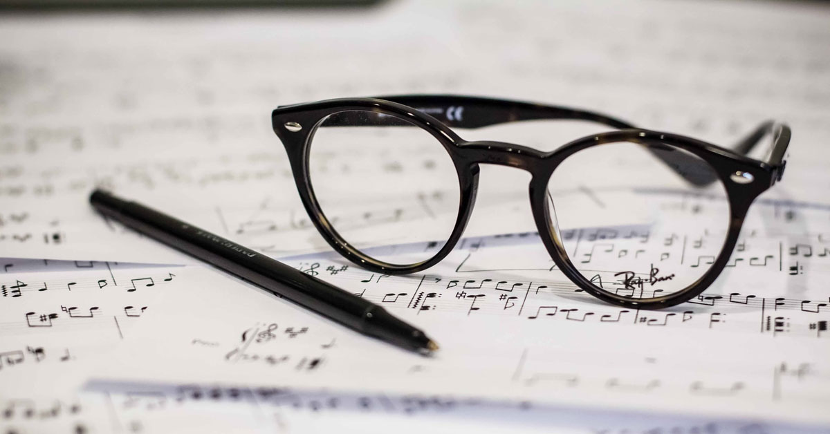 black eyeglasses and pen on music sheets, How To Form Chords From Scales featured image by LuffyKudo